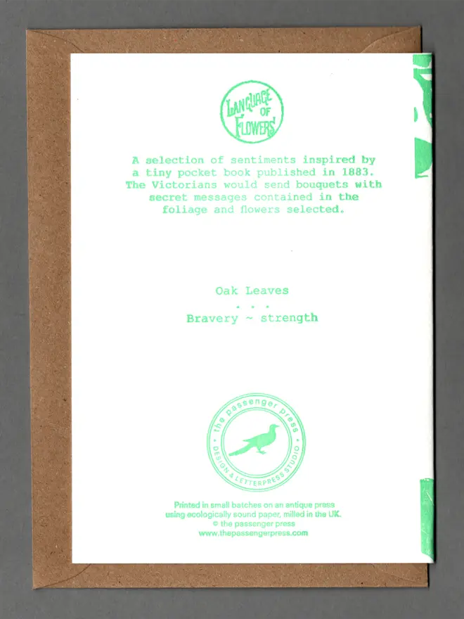 Backside of folded card. Green text in typewriter-style font. "Oak Leaves. Bravery. Strength.