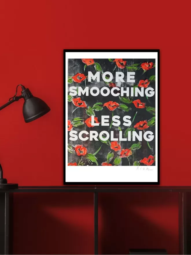 MORE SMOOCHING, LESS SCROLLING fine art print.  Based on an original monoprint by M.E. Ster-Molnar.  Shown in a room with a black lamp and black table and red wall.  
