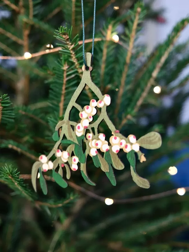 Wooden Mistletoe Decoration seen on a Christmas tree