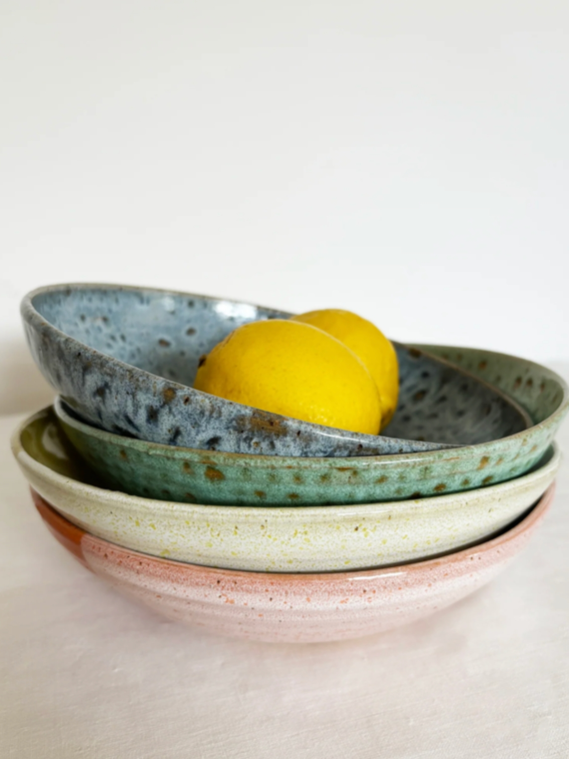 Pasta Bowl. Four pasta bowls in, from top to bottom, Blue, Green, White, and Pink.