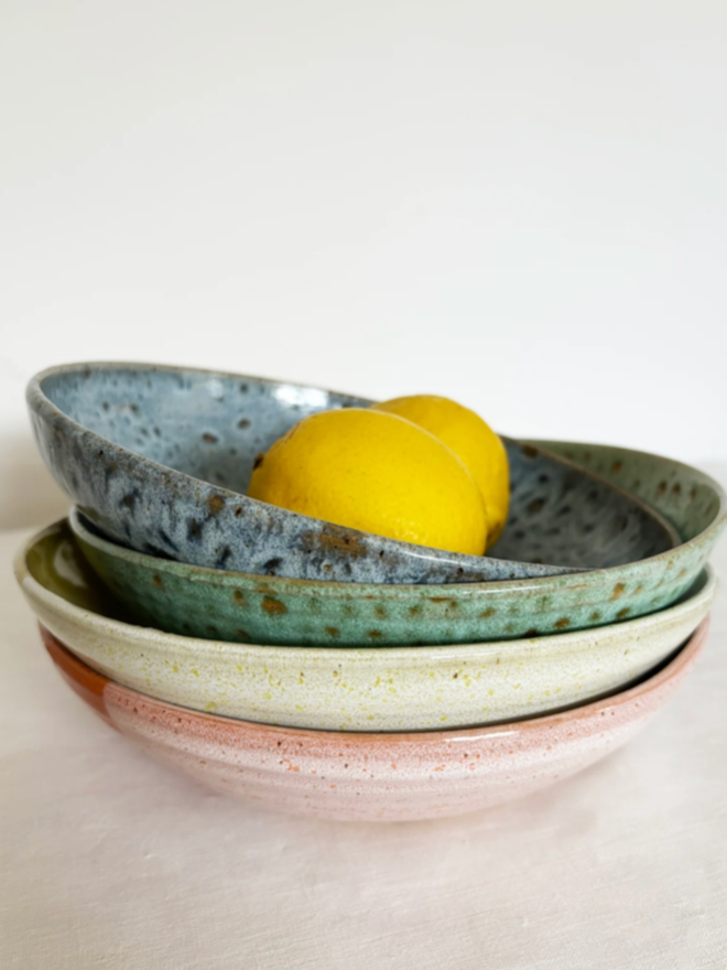 Pasta Bowl. Four pasta bowls in, from top to bottom, Blue, Green, White, and Pink.