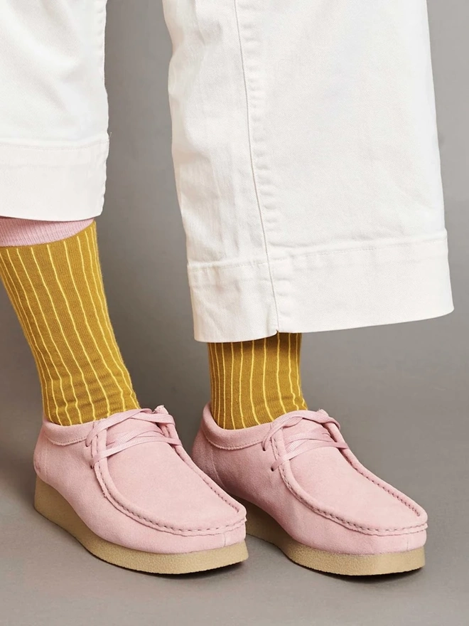 Women's Organic Cotton Ankle Socks Packs (Sets Of 3), a person wearing a pair of colourful patterned socks. 