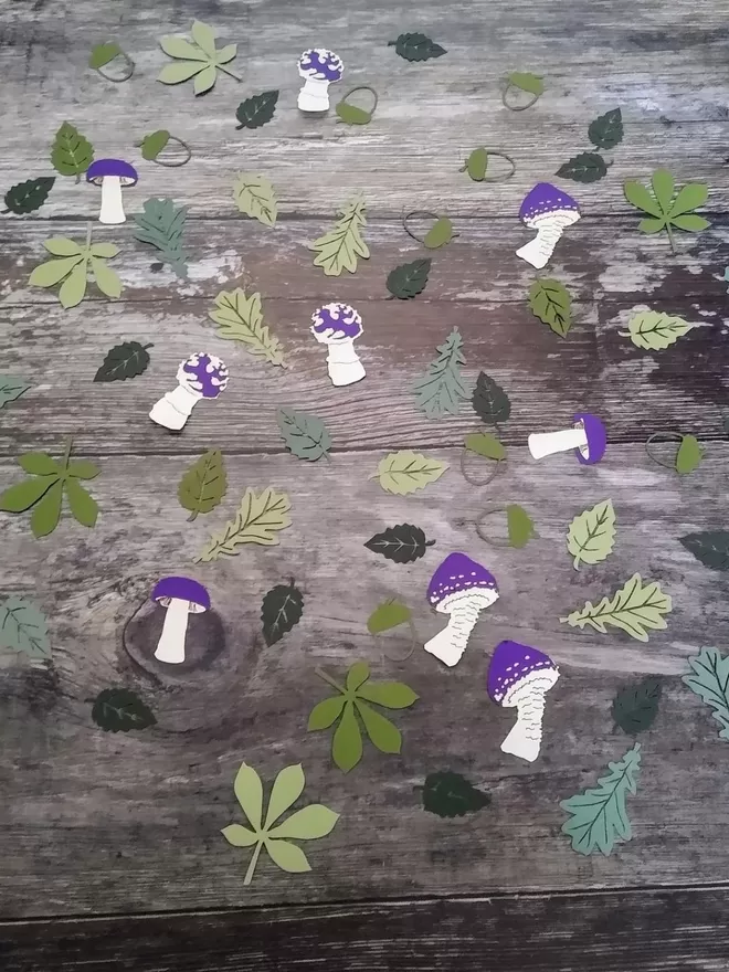 Woodland confetti purple colour variation. Leaves in a variety of greens, toadstools a mix of white and purple