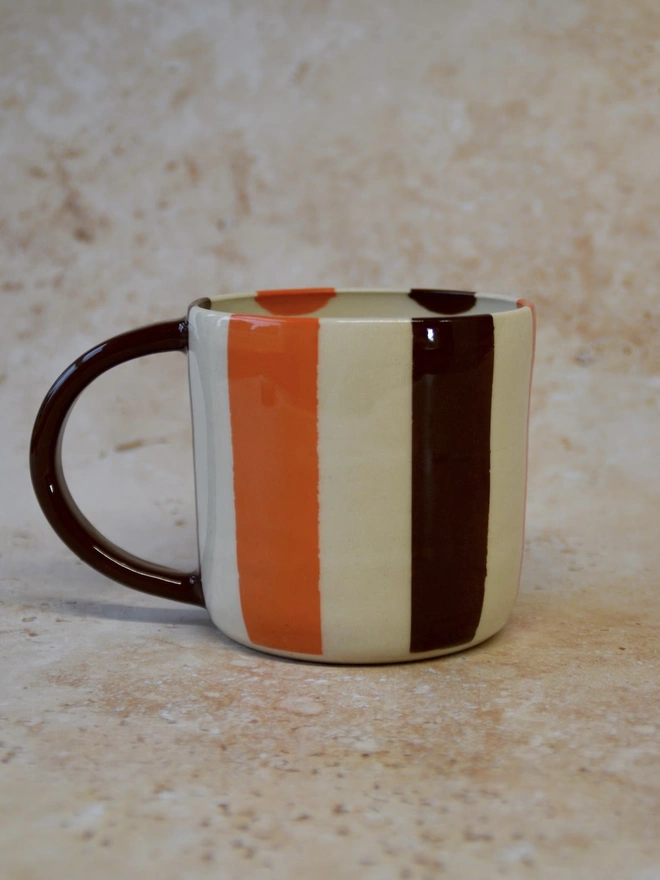 Bonbon Mug — handmade ceramic striped mug in brown and orange