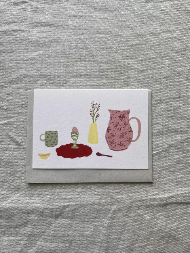 greetings card with jug, mug and a breakfast set up.