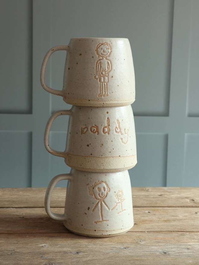 Handmade Stoneware Ceramic Mug glazed in which with daddy writtne on the front in a child's handwriting 