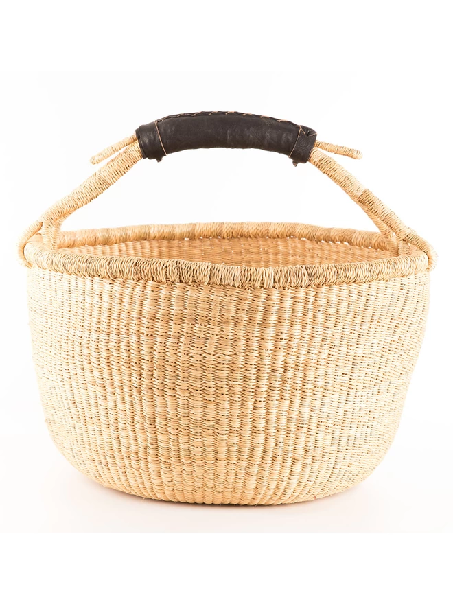 woven shopping basket with leather wrapped handle