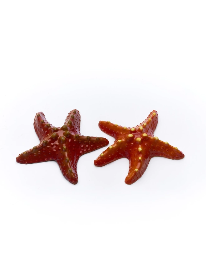Realistic edible chocolate starfish on white background