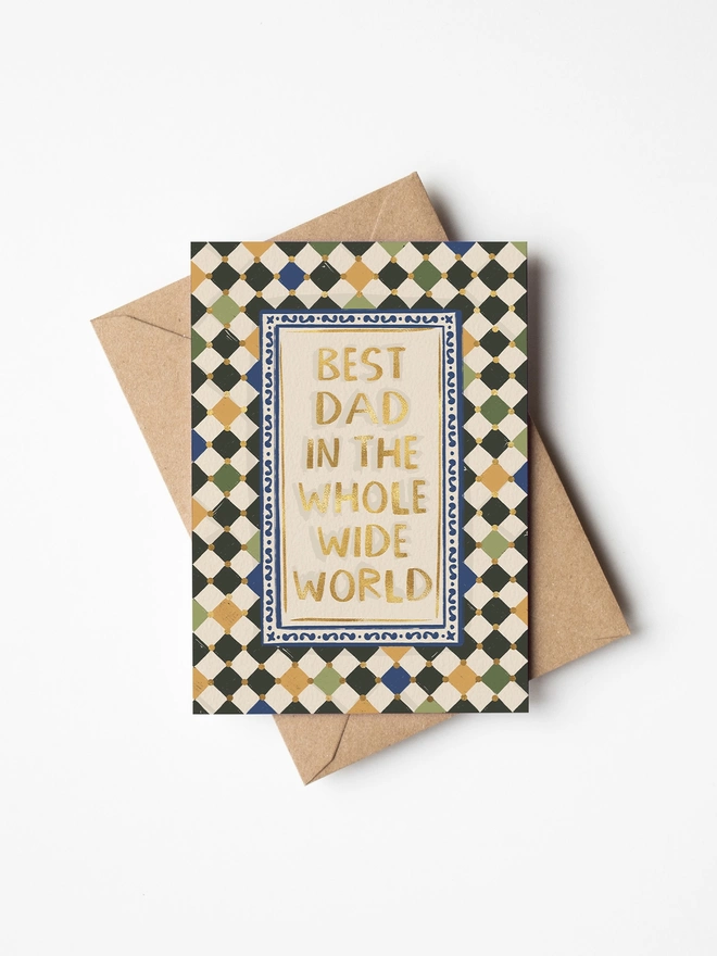 Best dad in the whole wide world gold foil text with harlequin checkerboard background