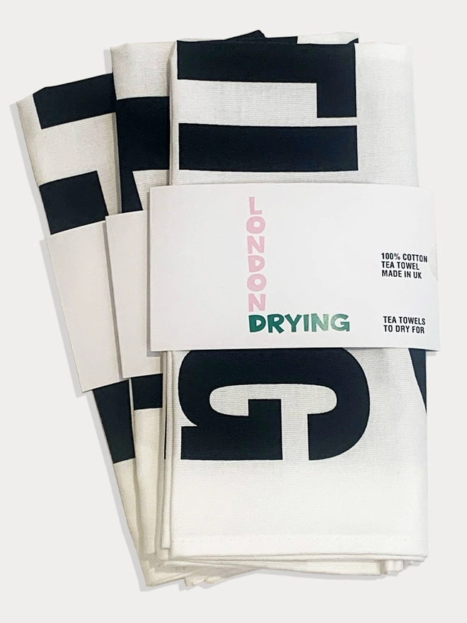 2 tea towels folded in London Drying brand packaging 