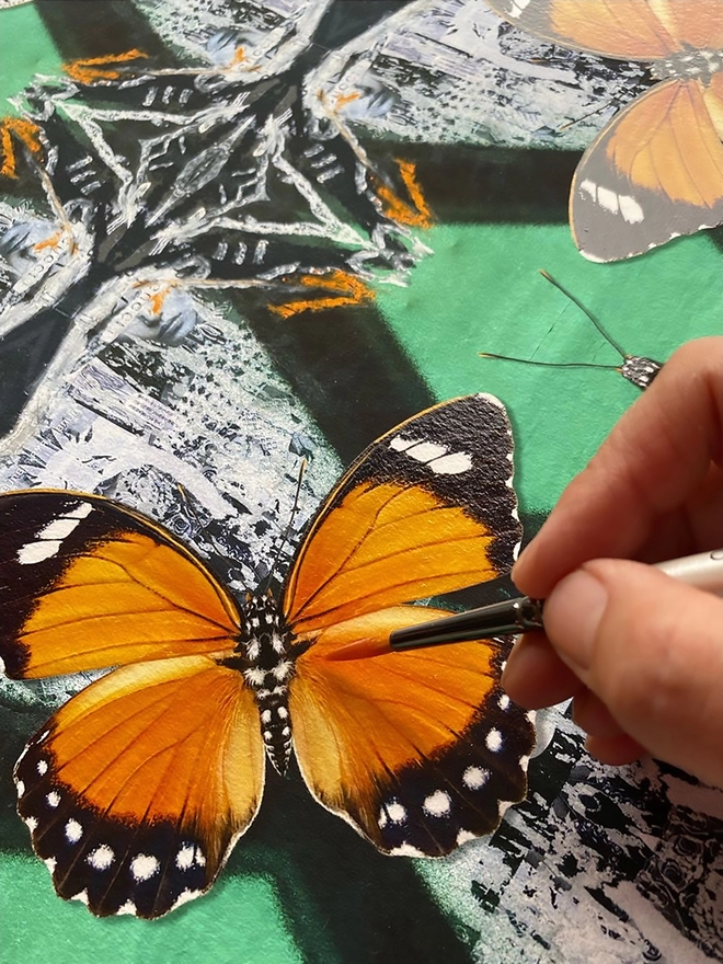 Hand glazing the hand cut three dimensional butterfly