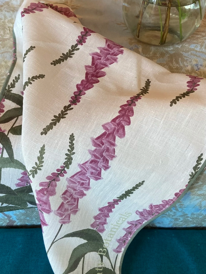 Foxglove Tea Towel. A white tea towel patterned with purple fox gloves.