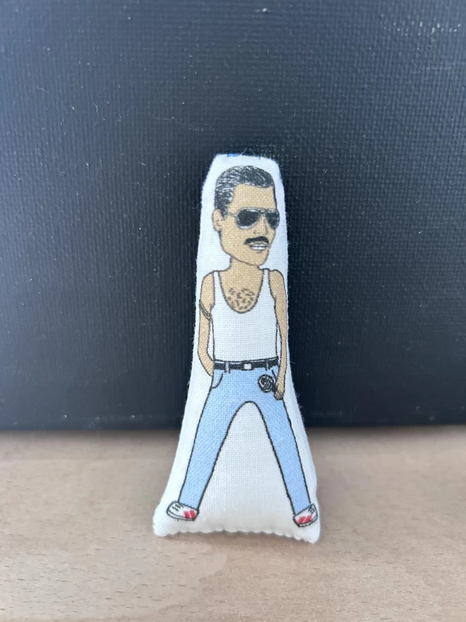 Mini fabric doll of Freddie Mercury.
