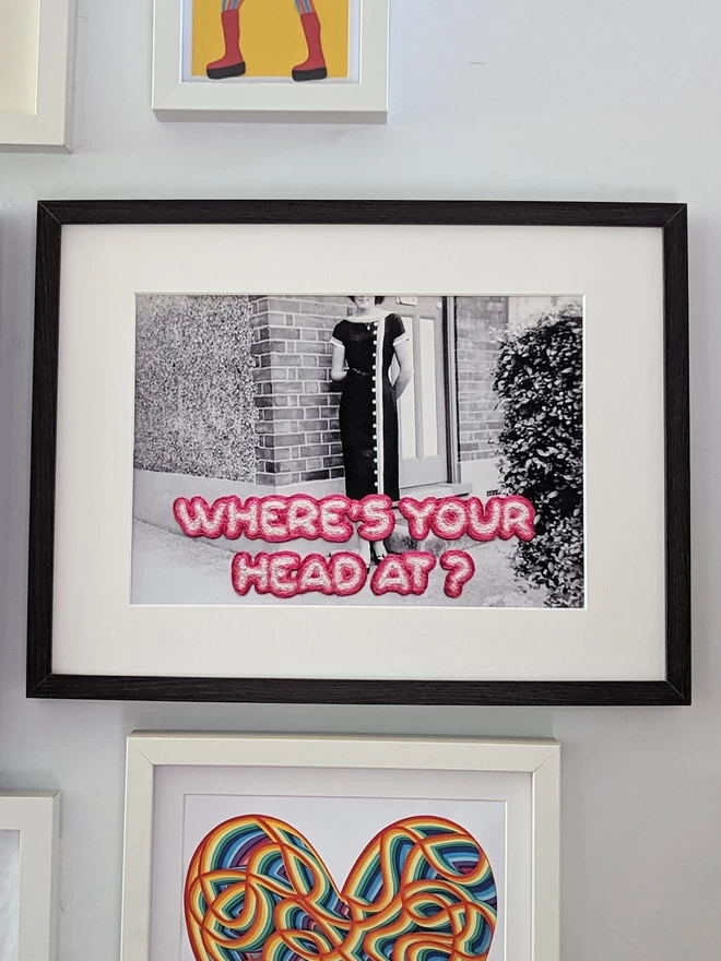 Print of embroidered Where's your head at? with missing head framed