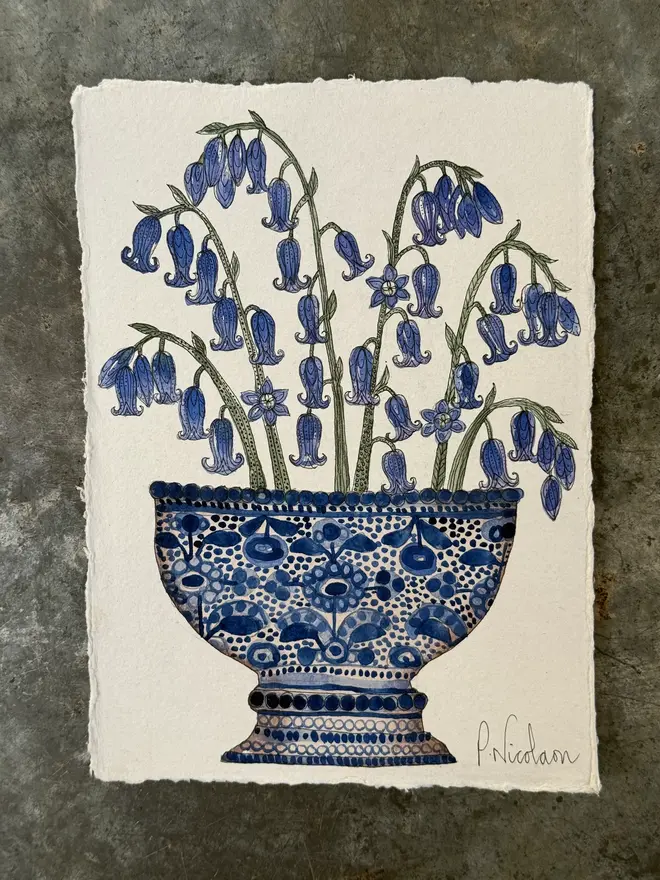 bluebells in a blue & white ceramic vessel