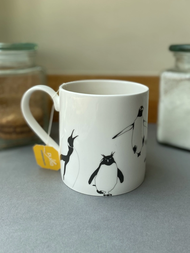 The dishwasher and microwave safe multi Penguin mug filled ready to drink