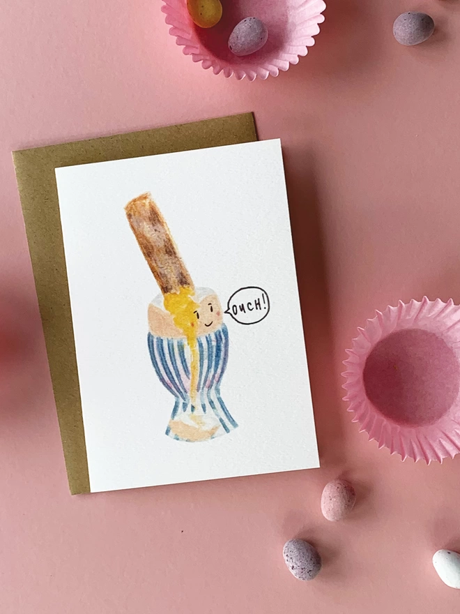 A fun and alternative Easter Card featuring a Dippy Egg sitting in an Egg Cup being prodded by a toast soldier 