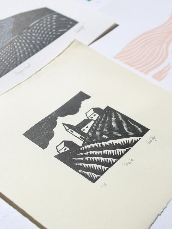 Linocut print rural farmland and houses