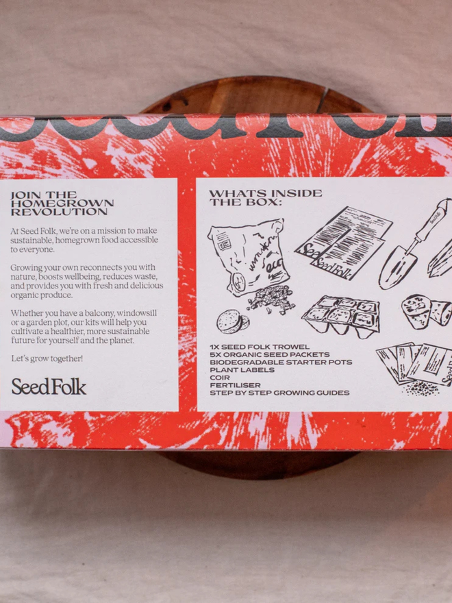 the seed growing starter kit. box in a decorative pink sleeve photographed from the back to show instructions.