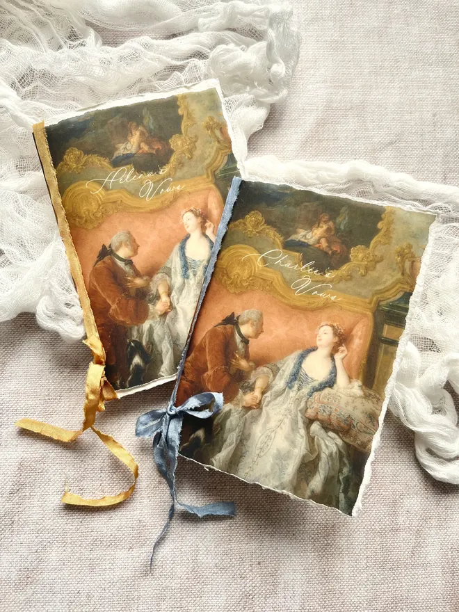 Rococo style blank vow booklets with handmade paper and silk effect ribbon