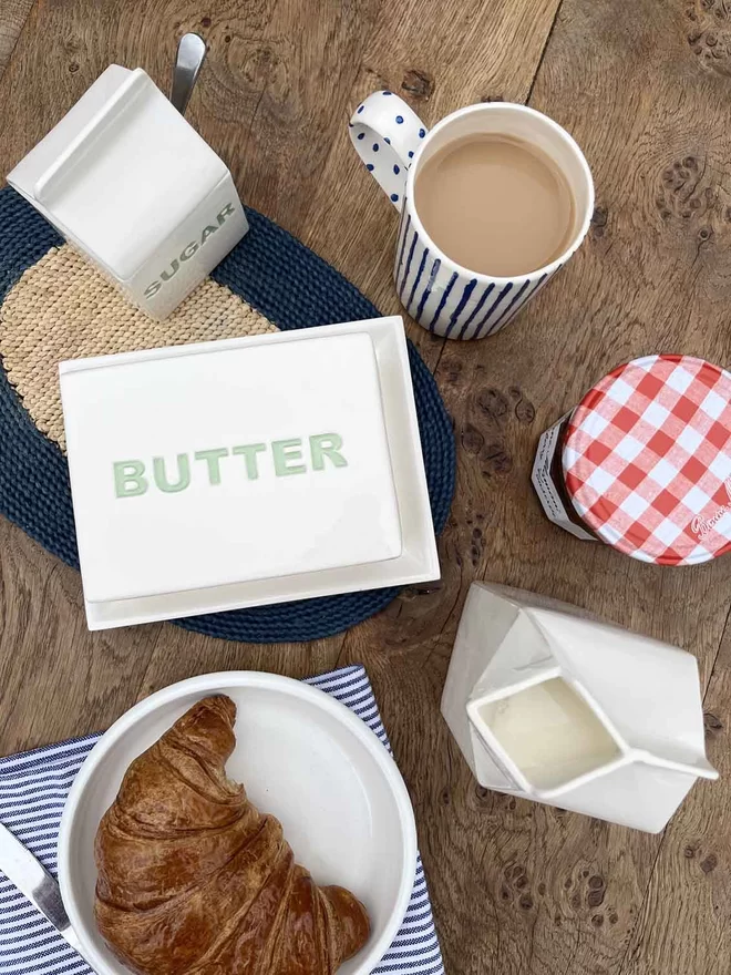 From above you see ‘butter’ is recessed in green capital letters on top of the handmade lid.