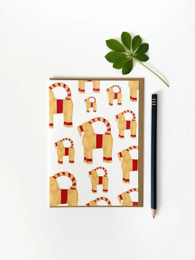 Christmas Straw Goat greeting card on white backdrop