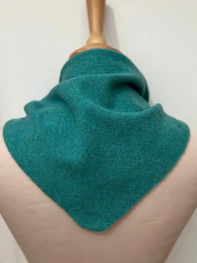 Penny Grace Knitwear Jade Triangle Scarf on mannequin showing back.