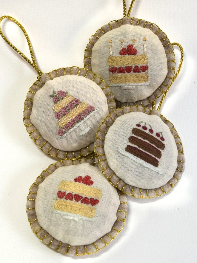 Finished matchbox embroideries (Birthday & Wedding cakes), turned into felt baubles.