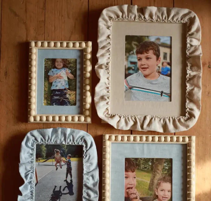 picture frames with tan and blue ruffled borders