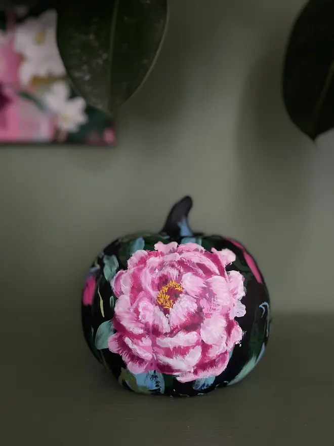 hand painted ceramic floral halloween pumpkin black background vibrant pink peonies 