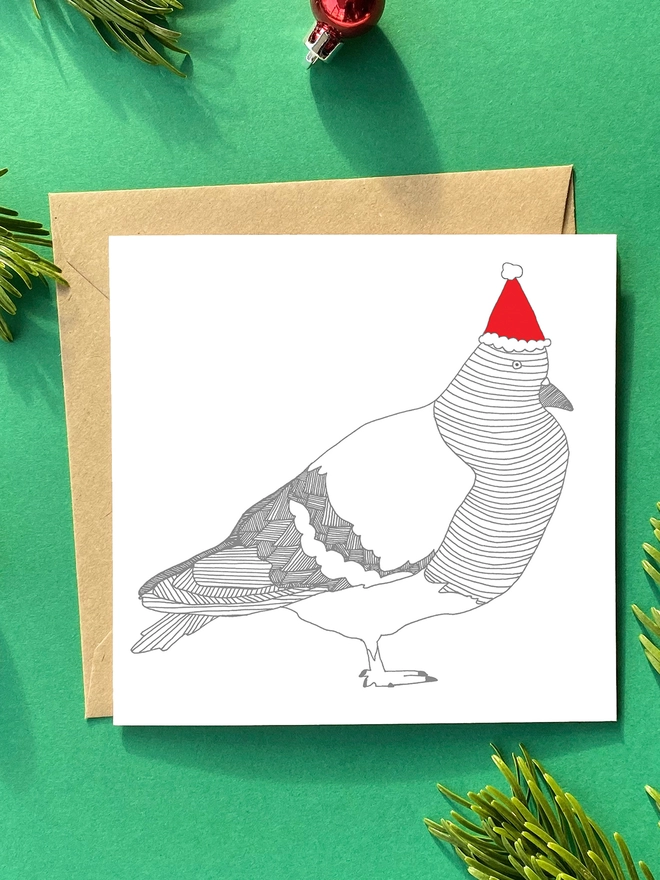 A festive christmas card featuring a pigeon in a xmas hat