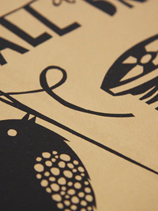 A screenprint with a brown background and black detail, bearing the message 'you can still do a lot with a small brain'. Photograph close up of black detailing of a bird threading a sewing needle.