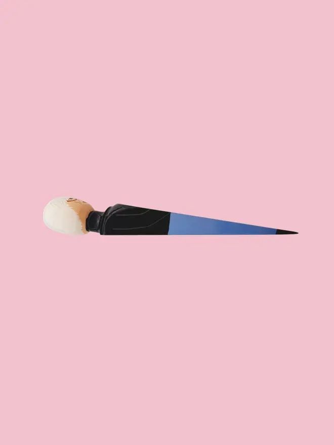 Wooden Door Stopper (Andi), a colourful wooden door stop sitting on a white surface. 