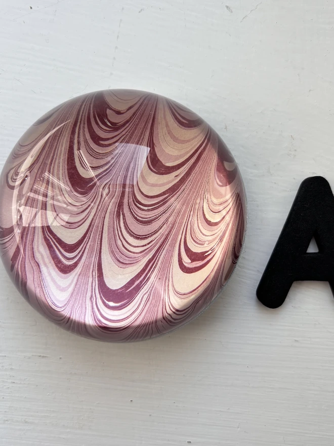 Small Paperweight. A paperweight in A