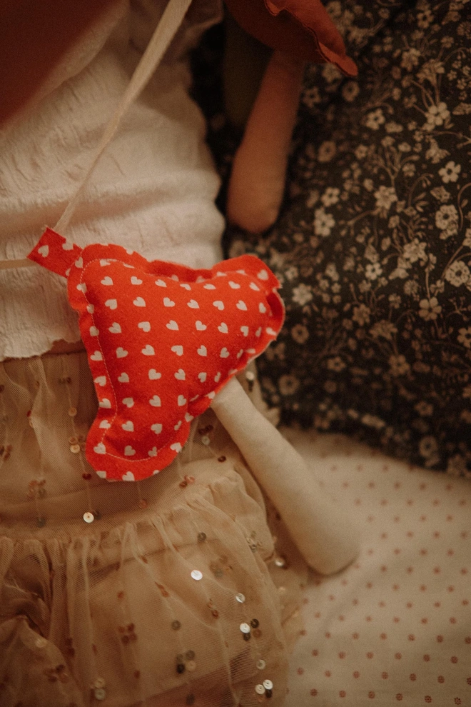 Mushroom Garland DecorationMushroom Garland Decoration, a mushroom garland sitting on a child's bed. 