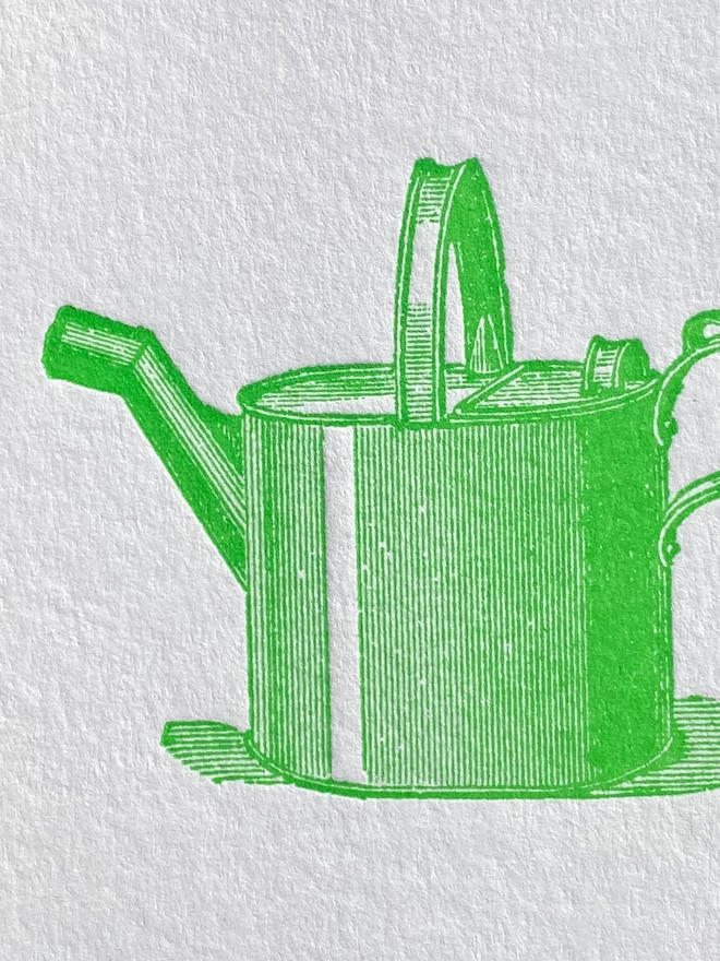 Close up of a green illustration of a watering can