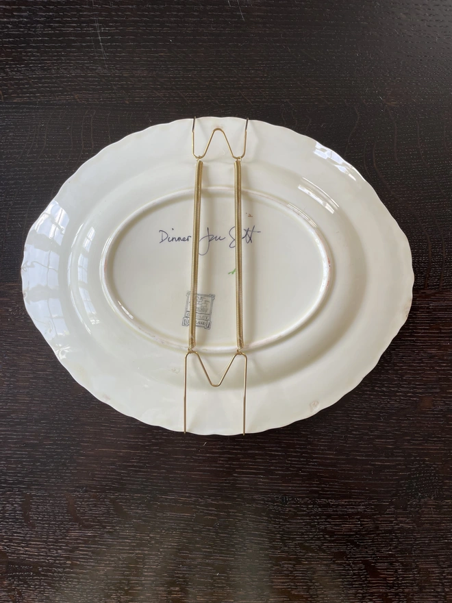 plate hanger on old painted plate