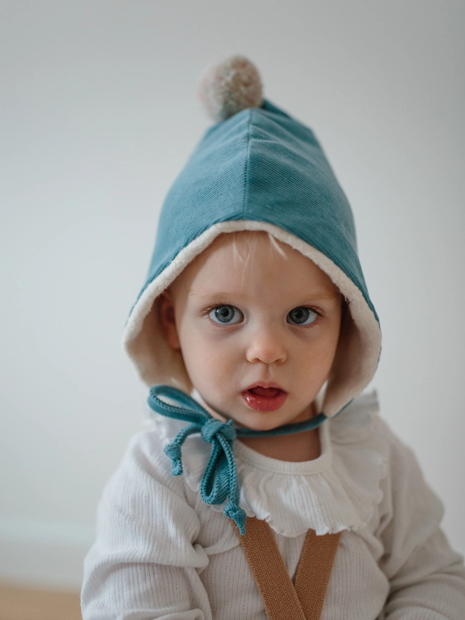 Baby her her winter Pixie hat in blue with fleece lining