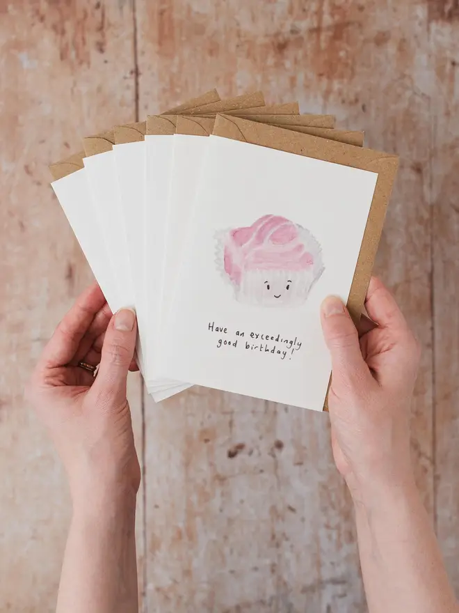 Hands holding Fondant Fancy Birthday Cards