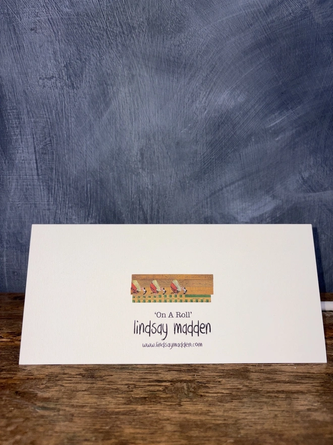 Back view of On a Roll Art Card