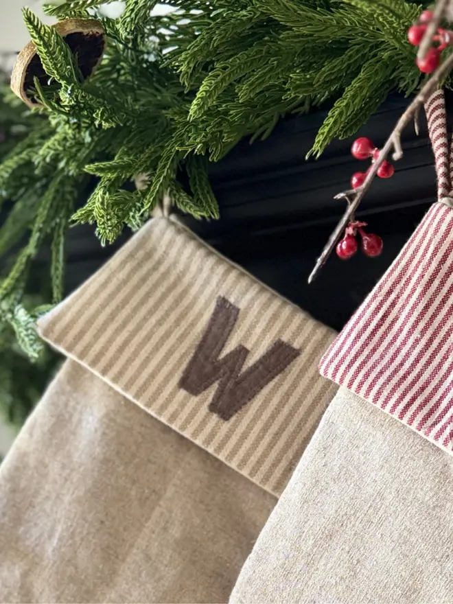 Floral Linen Christmas Stocking. Natural Linen Stocking with natural stripe cuff and initial W