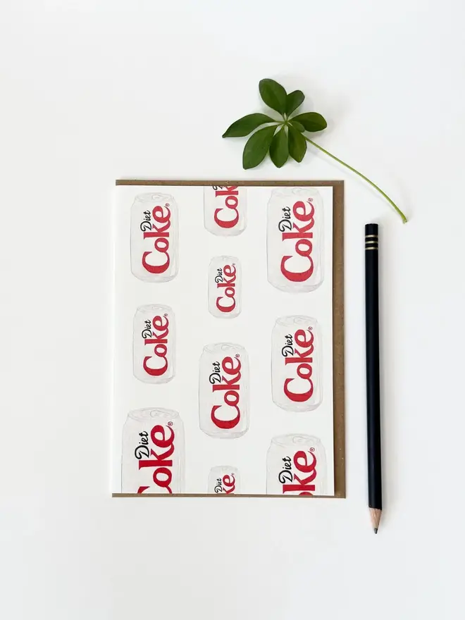 diet coke cans illustrated card. card photographed against white background.