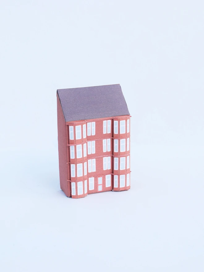 A paper tenement in red sandstone colour