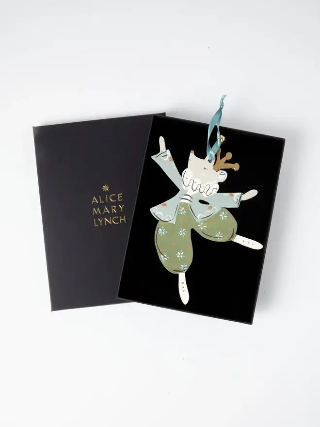 Mouse King Tree Dancer. wooden hanging mouse king decoration in an open black gift box embossed "alice mary lynch" in gold, with sage green jacket, floral trousers and duck egg blue ribbon with a jingle bell
