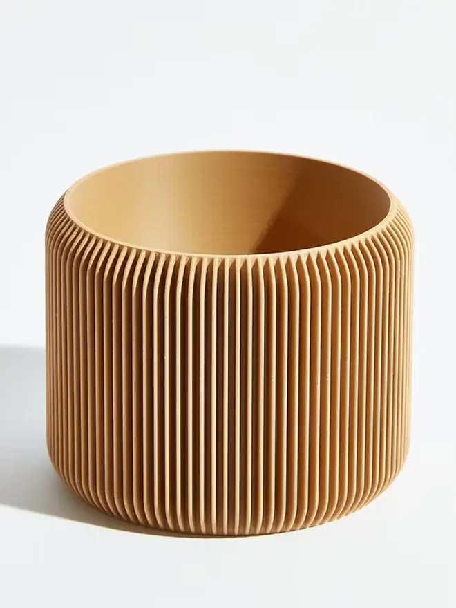 Sustainable 3D Printed Sand Beige Plant Pot, turbin design against a white background.  