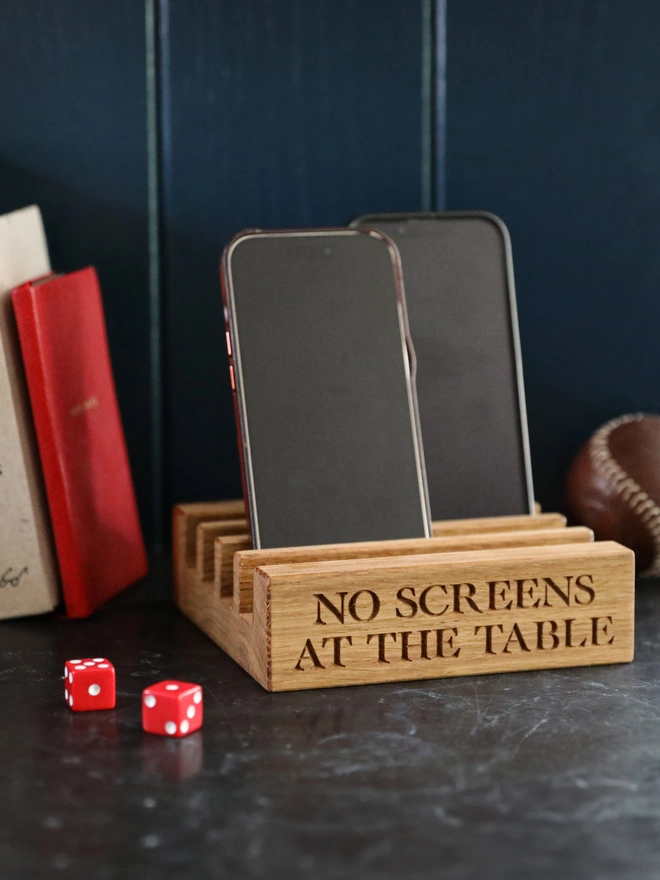 A place to park phones when sitting by a table