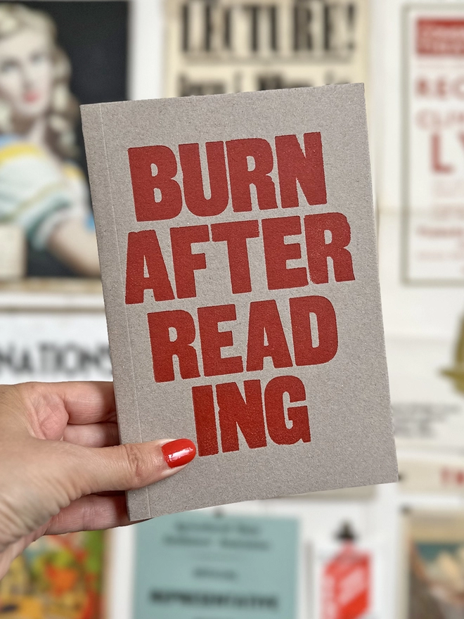 Burn after reading notebook with red type