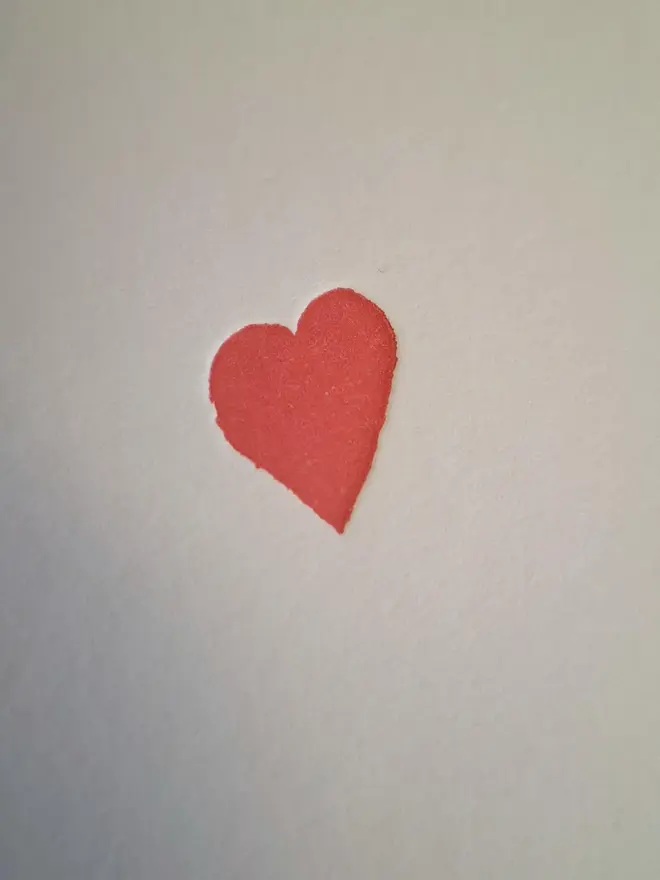 Small Red Heart Letterpress Handprinted Greetings Card, a white card with a small red heart. 