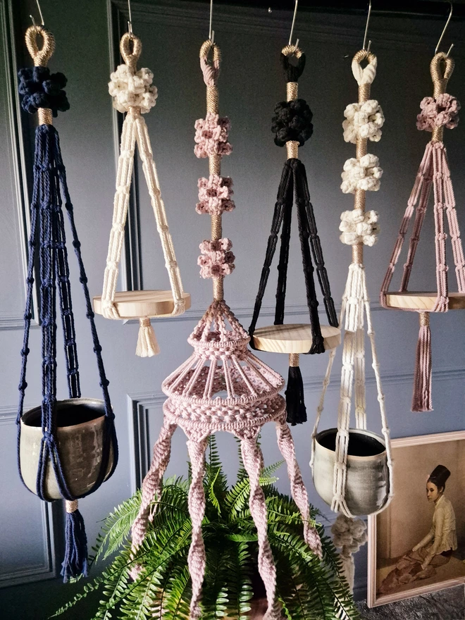 A unique and luxurious collection of handmade macrame plant hangers to add style and personality to home lovers, plant lovers, art and design fans, featuring rose fiber knots and wood base