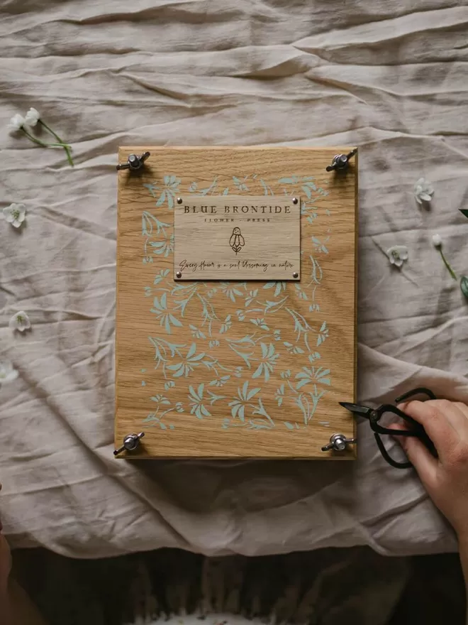 Wooden Flower Press - Medium birds eye shot of the flower press on a table